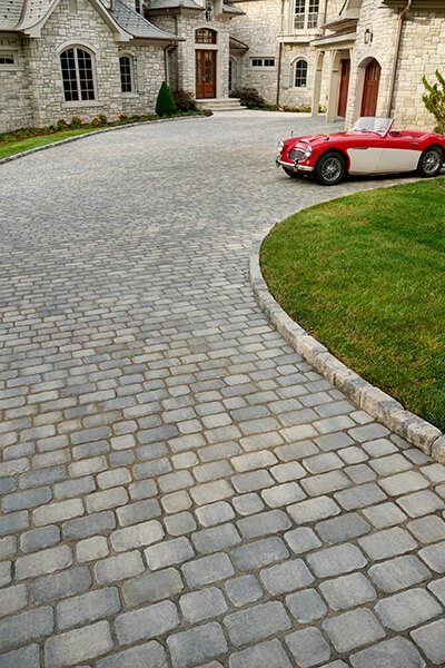 Aged grey paver driveway