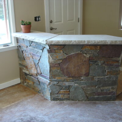 Limestone countertop with mosaic stone veneer